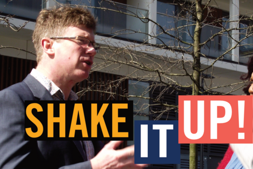Simon de Deney talks to supporters in Dalston Square. Caption: Shake it Up!